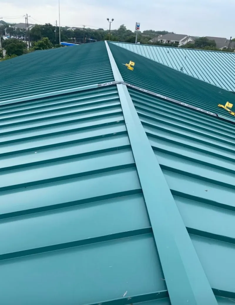 Green commercial metal roof ridge and valley for Metal Roof Repair in Silverton