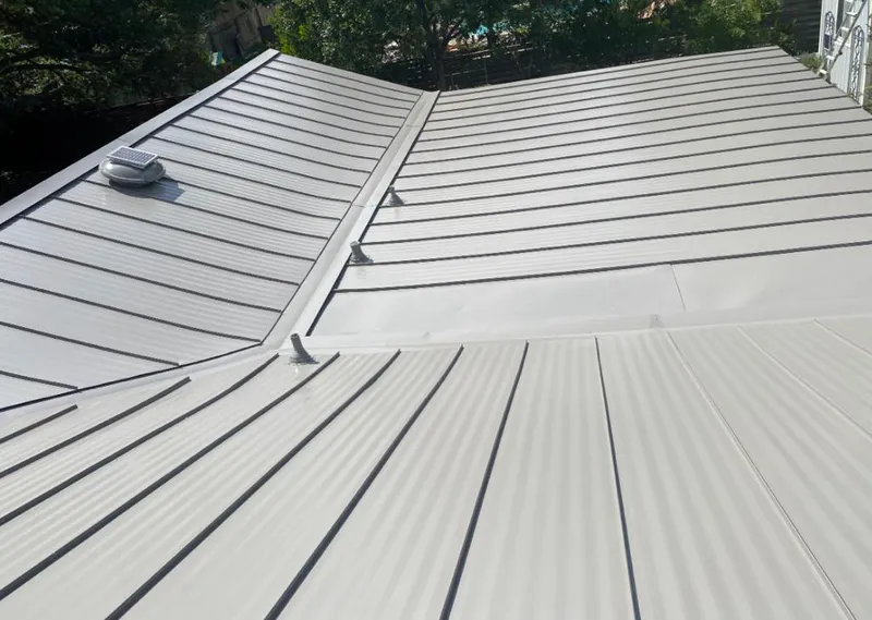 Solar attic fan installed on a metal roof for Roof Ventilation in Silverton